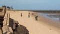 Locals collecting shellfish along the beach